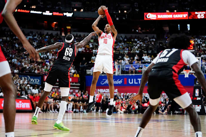 Jul 7, 2023; Las Vegas, NV, USA; Houston Rockets forward Jabari Smith Jr. (10) shoots the ball against Portland Trail Blazers center Duop Reath (68) during the second half at Thomas & Mack Center. Mandatory Credit: Lucas Peltier-USA TODAY Sports